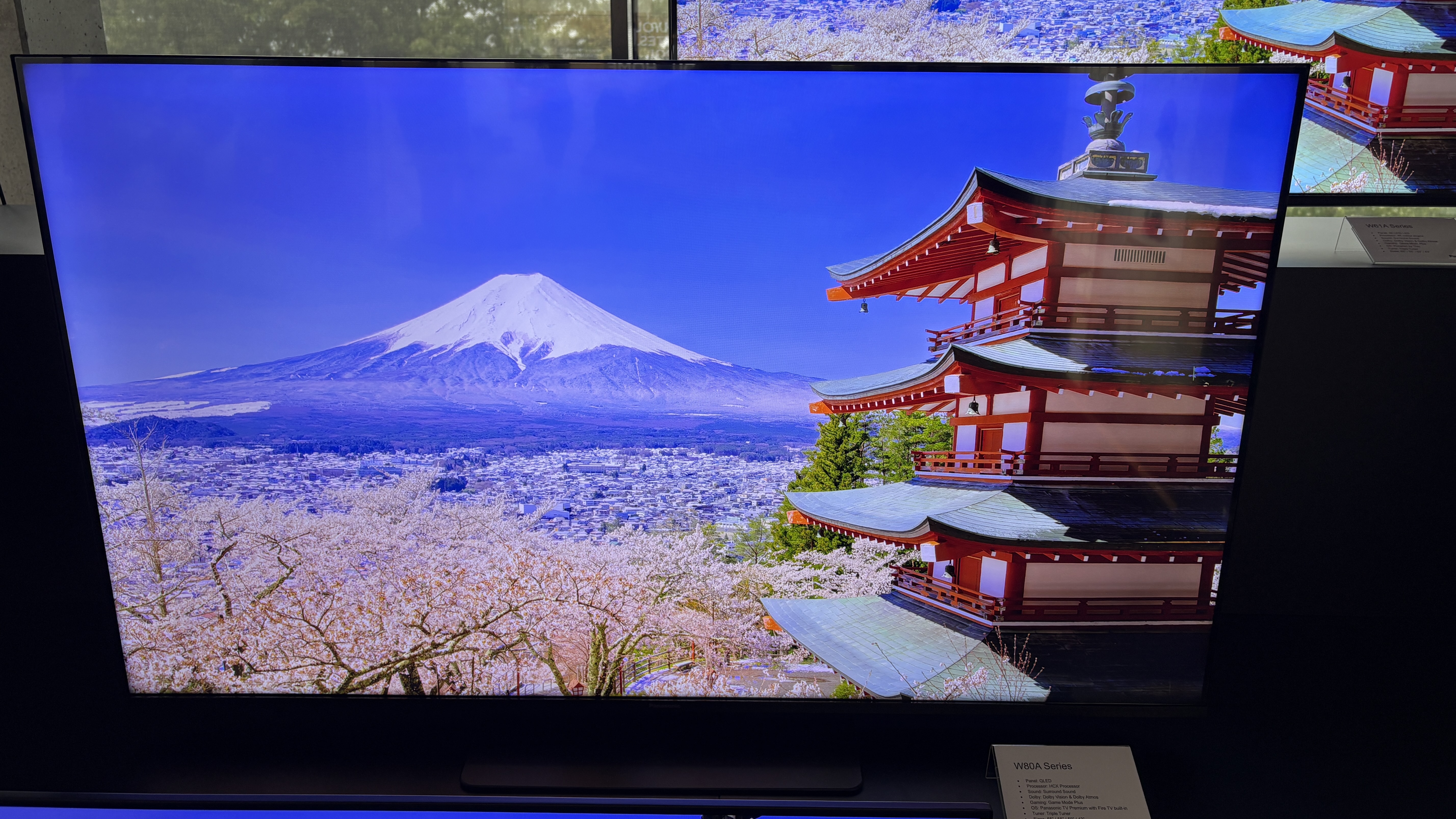 Panasonic TVs on a black show stand