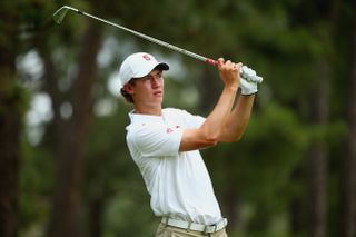 Maverick McNealy hits an iron shot during the 2014 US Open