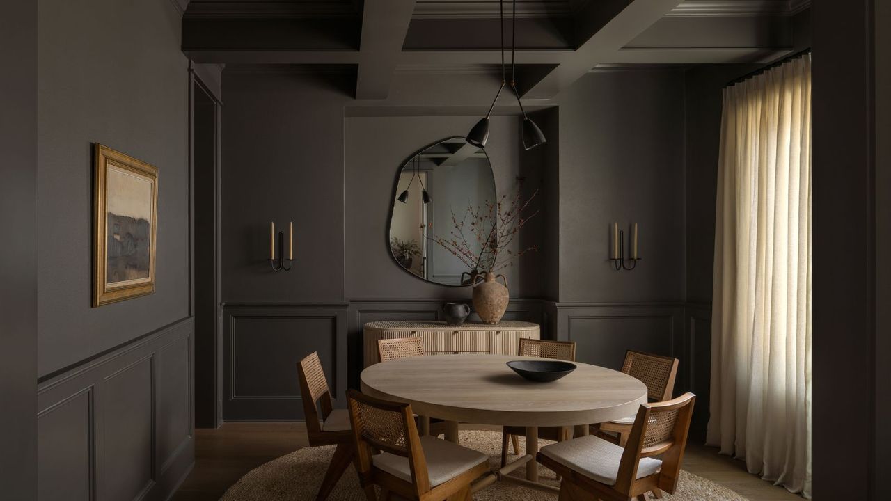 dark dining room with color drenched gray-brown walls