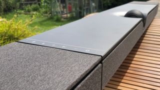 Devialet Dione soundbar shot on a table outdoors for natural light