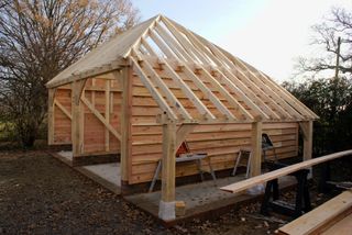 an oak frame garage being built