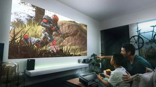 A father and son playing Halo on the Viewsonic X2-4K LED projector.