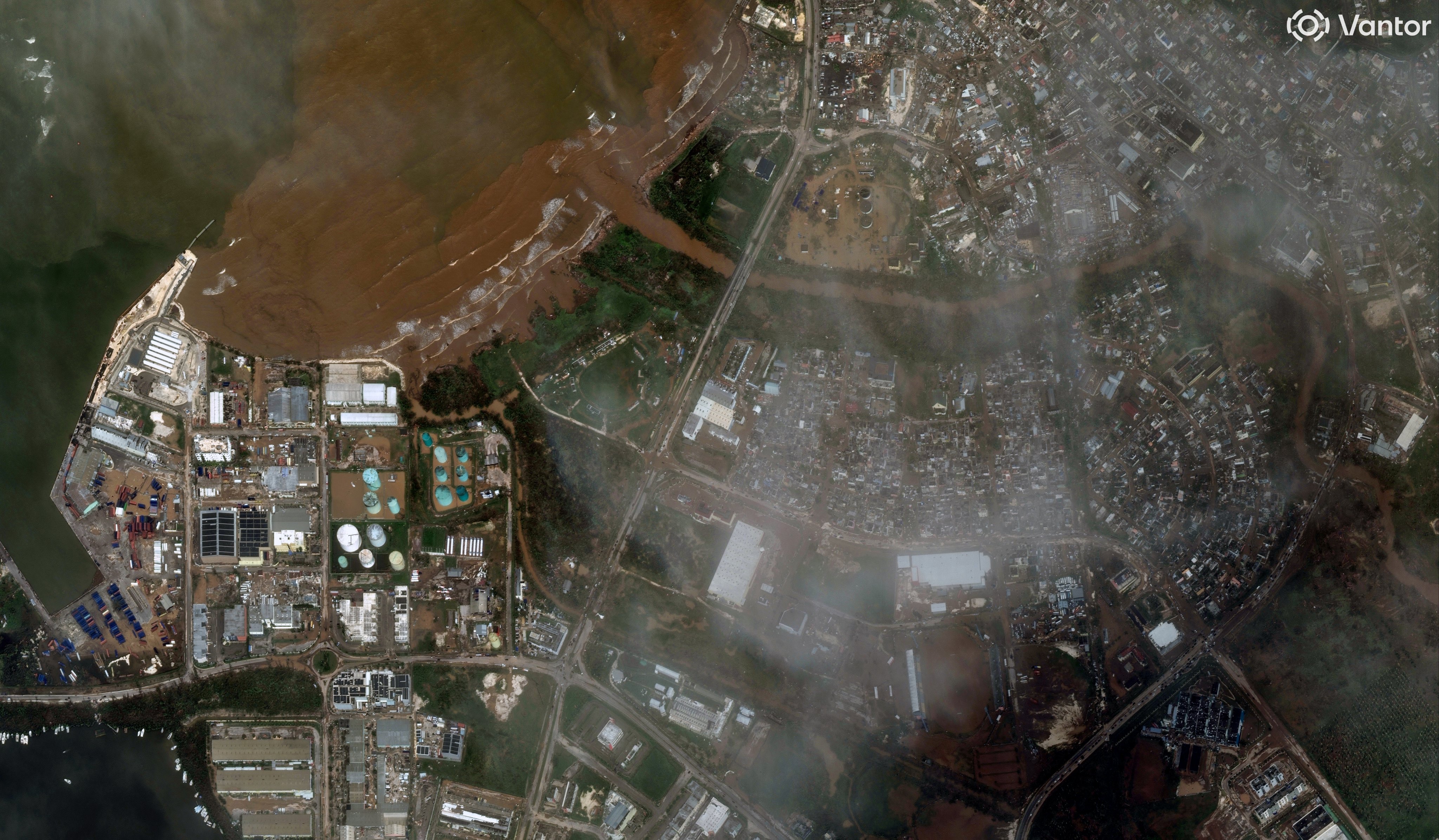 A series of satellite images from space showing the coastline of Jamaica with city blocks in ruins