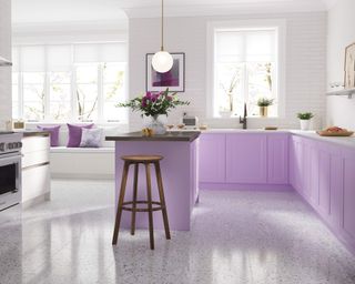 Modern kitchen with lilac island and cabinetry
