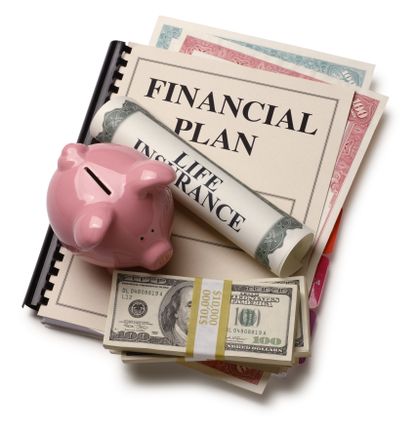 Spiral bound paper with "financial plan" written on first page. has a pink piggy bans, bundles of cash and scroll that has "Life Insurance" written in large letters