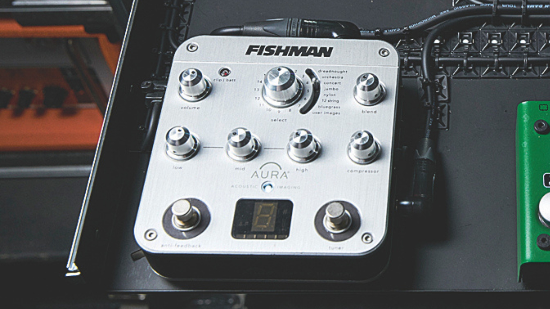 A Fishman Aura Spectrum preamp pedal on a pedalboard