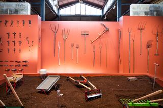 Tools for an agroecological transition, tools on orange background at Farmer Designers exhibition at Madd-Bordeaux