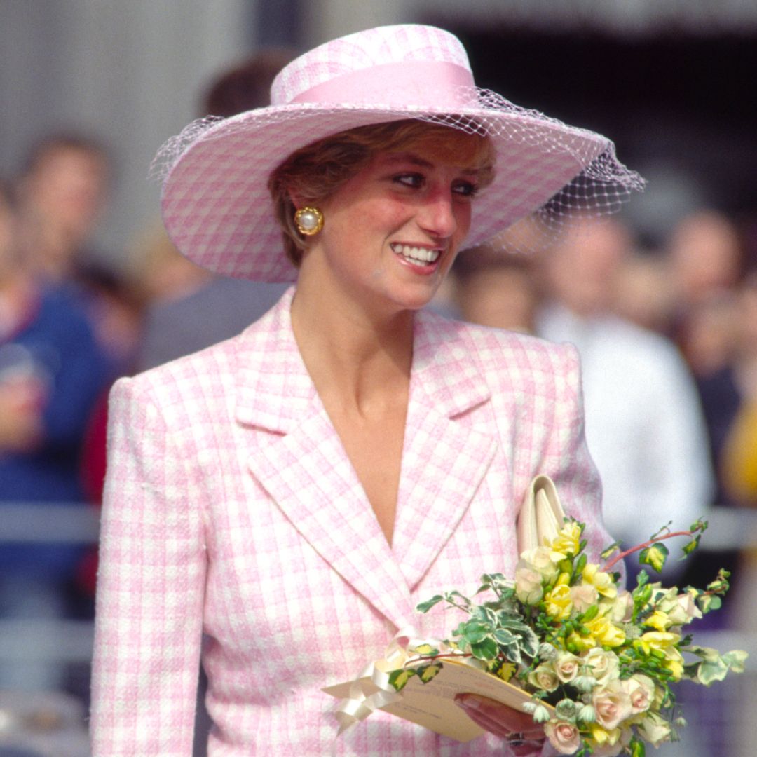 Princess Diana wearing a pink checked Armani suit and hat