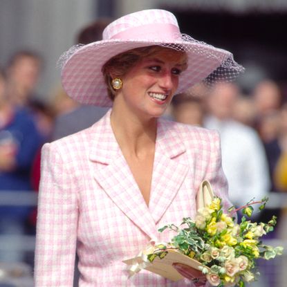 Princess Diana wearing a pink checked Armani suit and hat