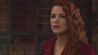 Courtney Hope as Sally in red staring off into space in The Young and the Restless