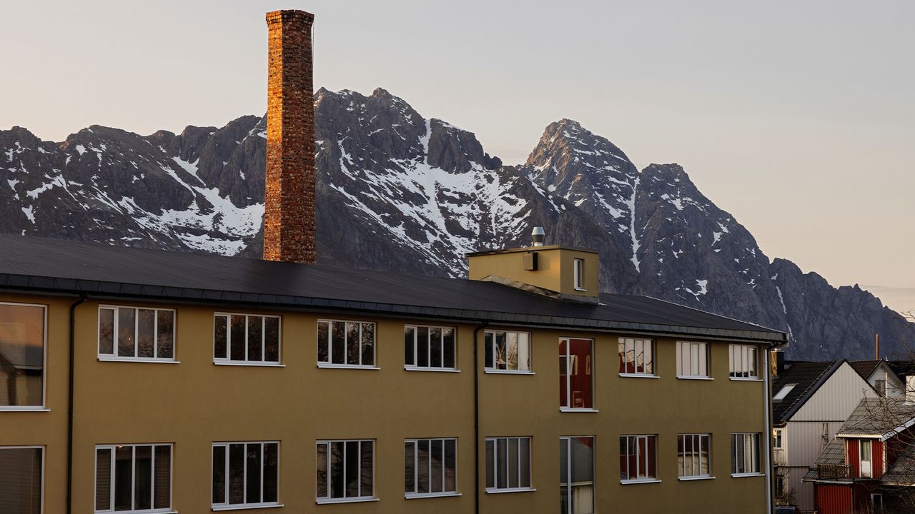 Mountain backdrop and exterior of Trevarefabrikken hotel Norway, designed by jonathan tuckey design