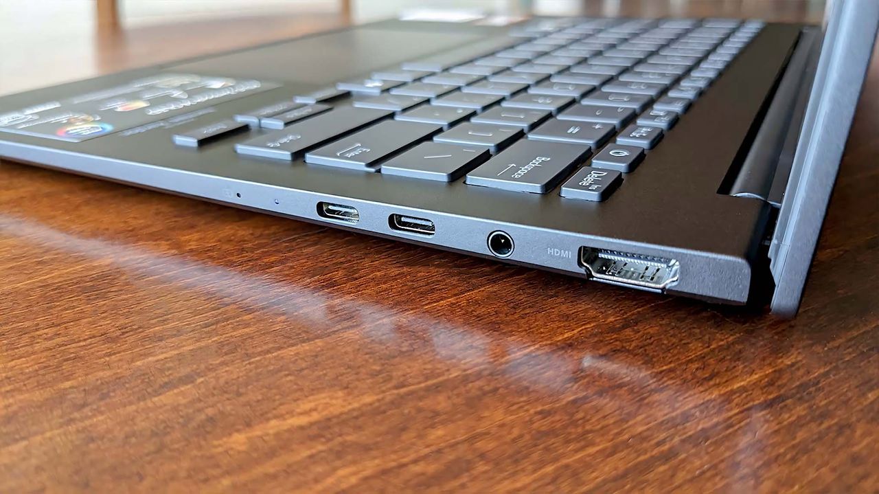 ASUS Zenbook 14 UM3406HA) right ports.