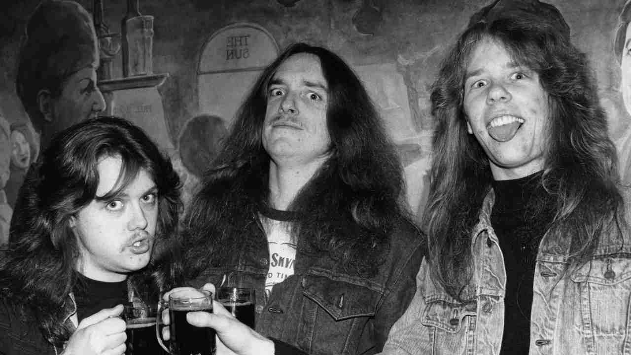 Metallica’s Lars Ulrich, Cliff Burton and James Hetfield posing with alcohol