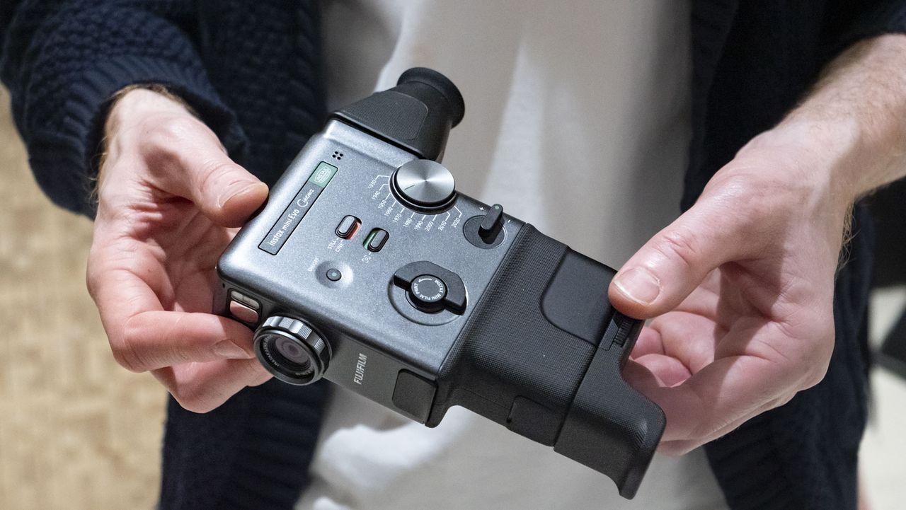 Fujifilm Instax Mini Evo Cinema camera in user's hands