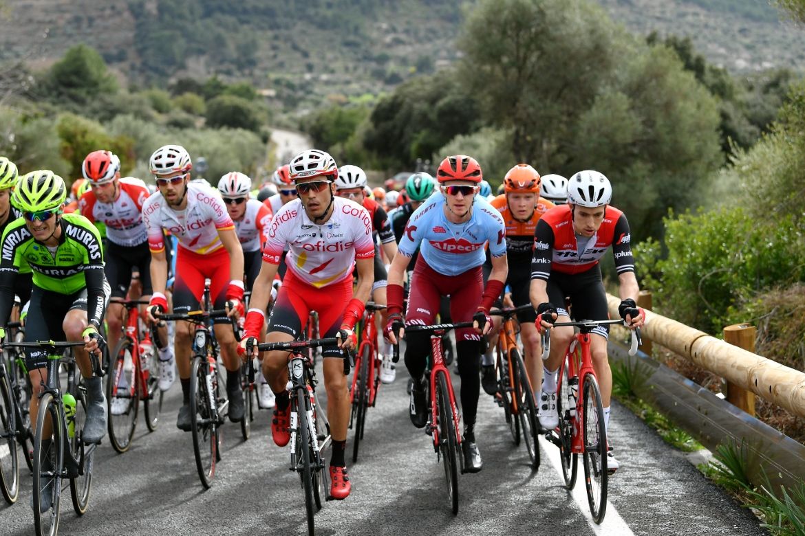 The peloton makes its way up a climb