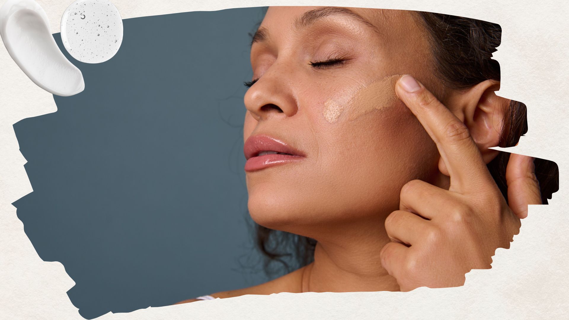 a woman applying foundation to her cheek on a blue backdrop next to swatches of moisturiser and serum
