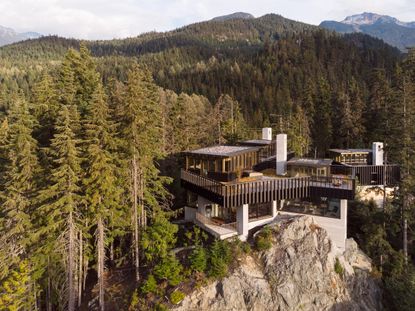 hero aerial overview of The Rock house by Gort Scott set in the wilderness 