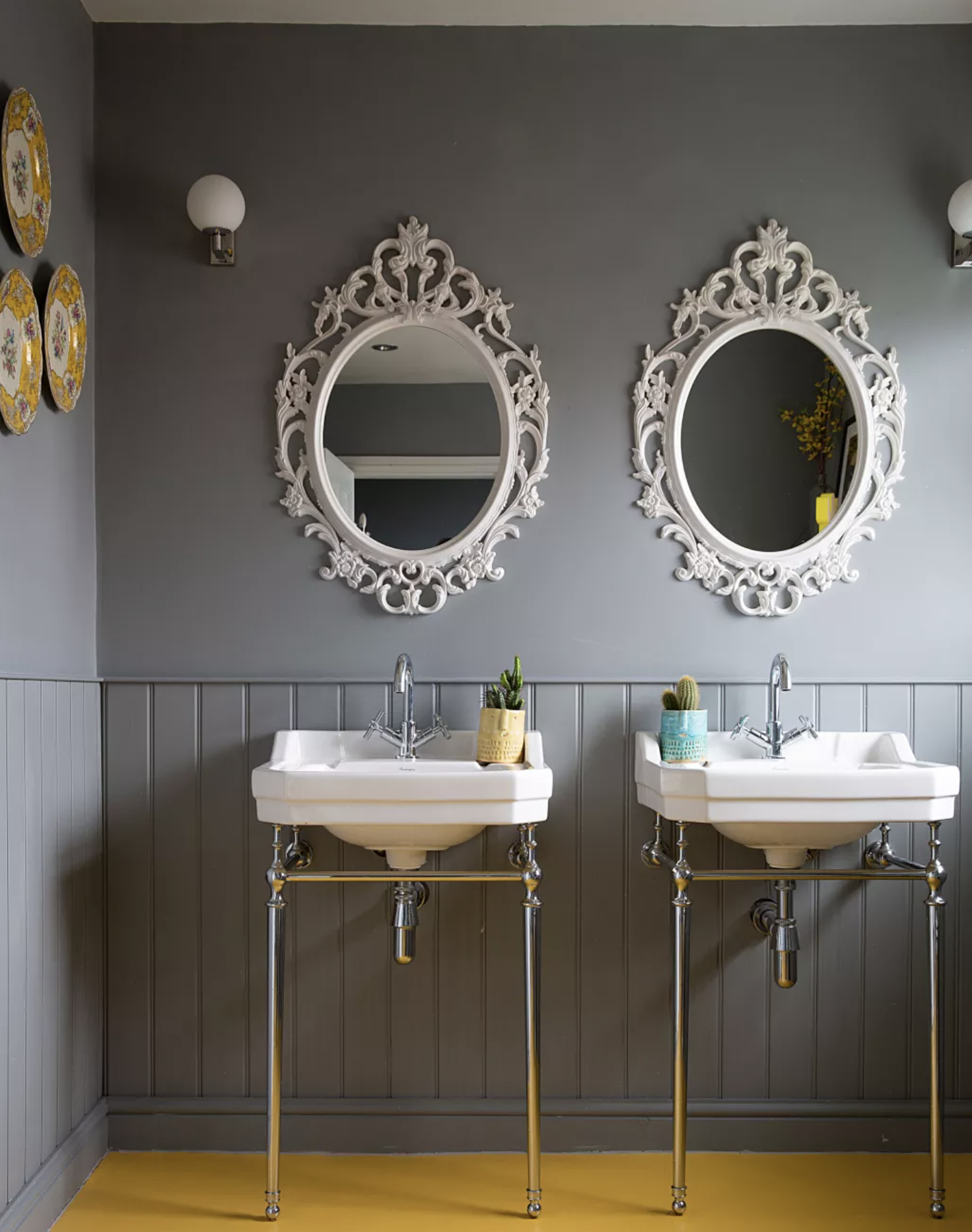 Grey bathroom with double sink and yellow floor