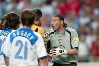 Russia goalkeeper Sergei Ovchinnikov protests to the referee during his side's defeat to Portugal at Euro 2004.