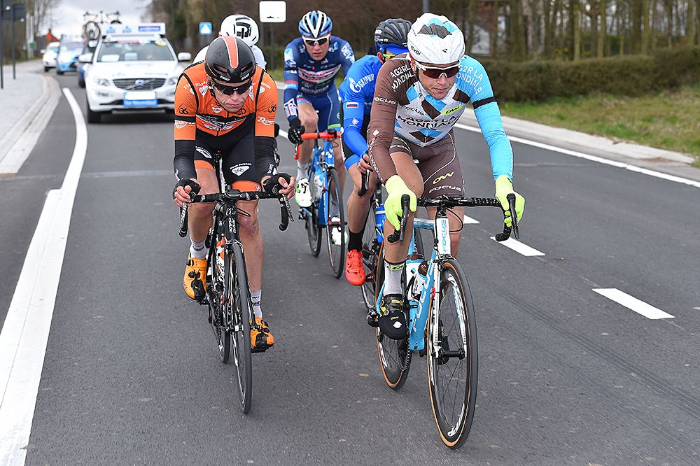 A breakaway sets off at Dwars door Vlaanderen
