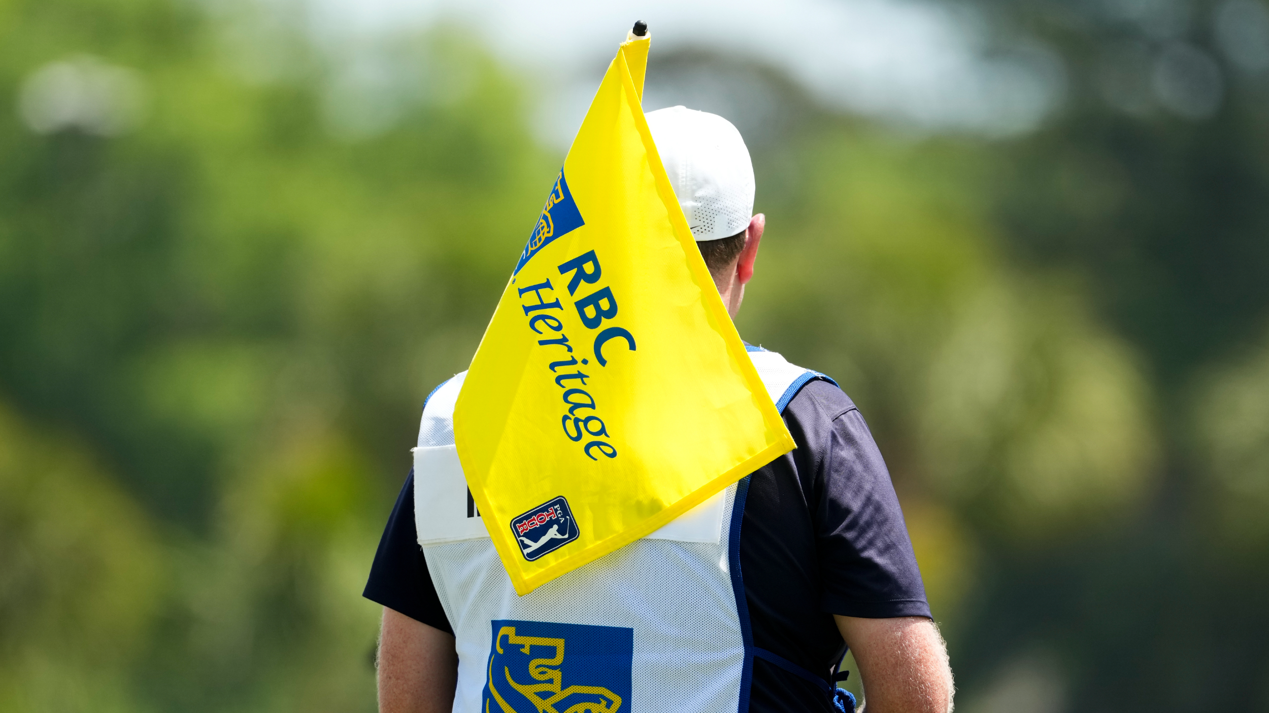 A caddie at the RBC Heritage