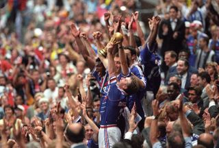 Didier Deschamps holds aloft the World Cup trophy after France's win over Brazil in 1998.
