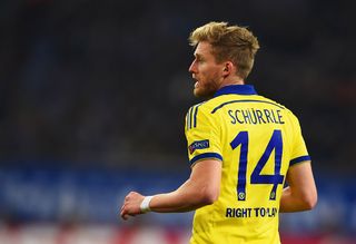 Andre Schurrle of Chelsea looks on during the UEFA Champions League Group G match between FC Schalke 04 and Chelsea FC at Veltins-Arena on November 25, 2014 in Gelsenkirchen, Germany.