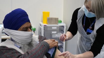 A man receives his Covid vaccine in Wolverhampton