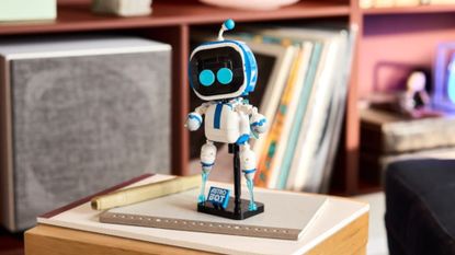The Lego Astro Bot set sitting on a table