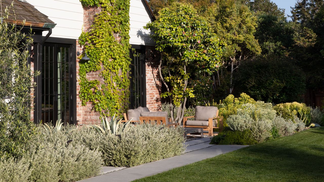 a landscape backyard and seating area