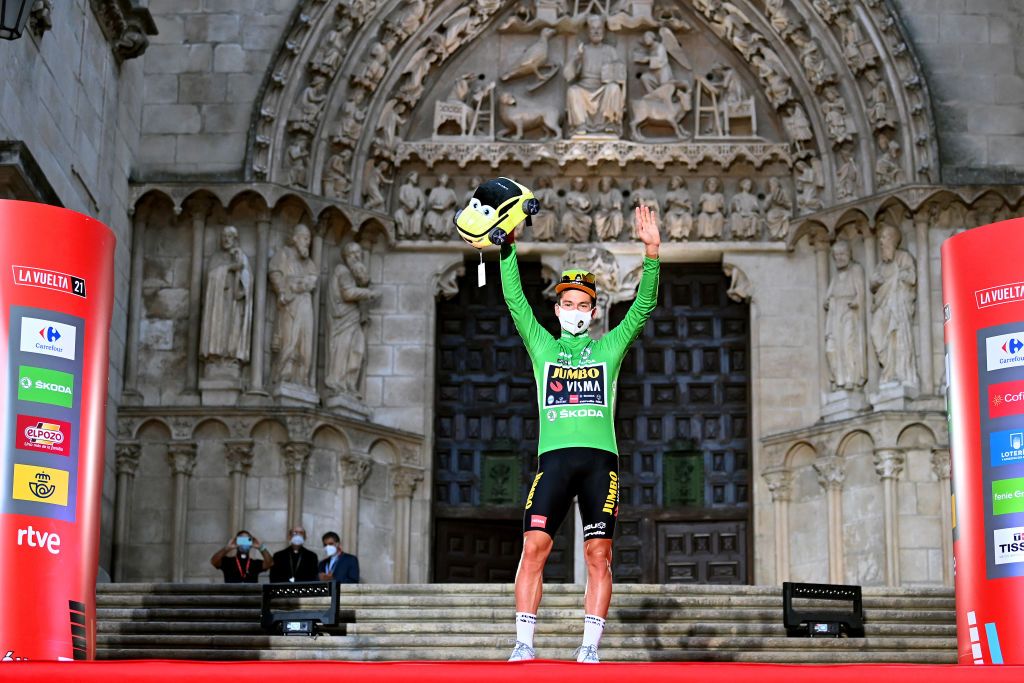 BURGOS SPAIN AUGUST 14 Primoz Roglic of Slovenia and Team Jumbo Visma celebrates winning the green points jersey on the podium ceremony after the 76th Tour of Spain 2021 Stage 1 a 71km individual time trial from Burgos Catedral de Santa Mara to Burgos lavuelta LaVuelta21 CapitalMundialdelCiclismo catedral2021 on August 14 2021 in Burgos Spain Photo by Stuart FranklinGetty Images