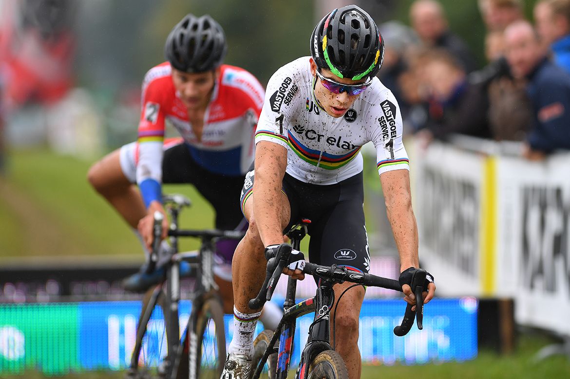 Wout Van Aert (Crelan-Vastgoedservice) leads over the barriers