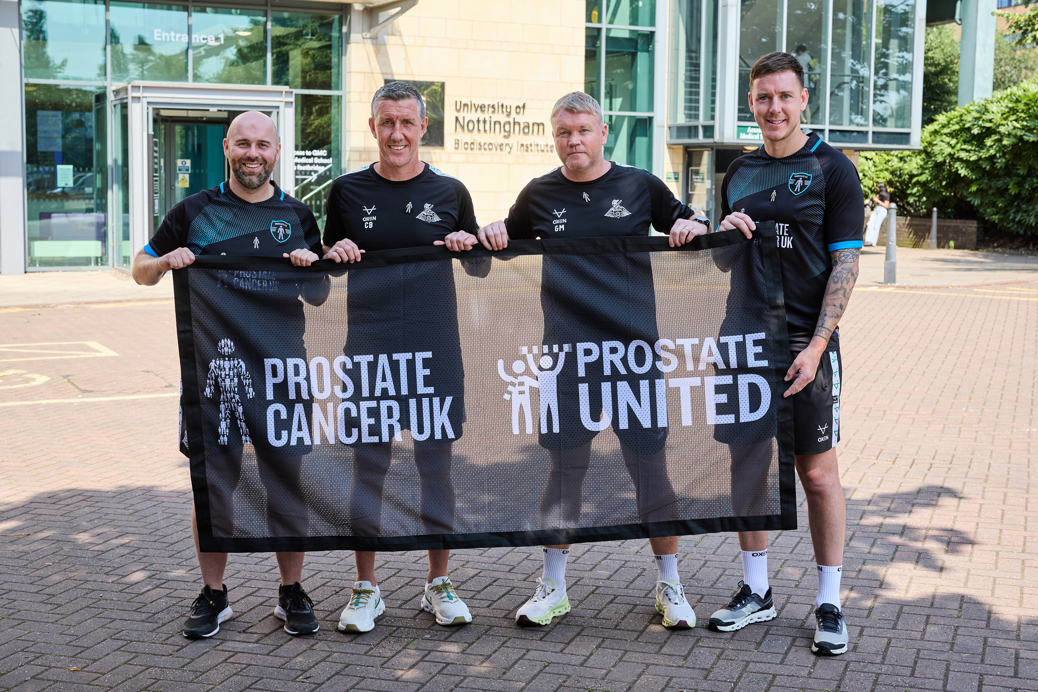 Prostate United pose with Doncaster Rovers manager Grant McCann at the University of Nottingham