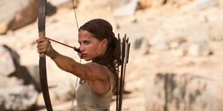 Alicia Vikander with a bow and arrow in Tomb Raider