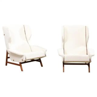 italian wingback chairs on a white background