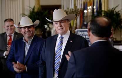 President Trump wears a cowboy hat