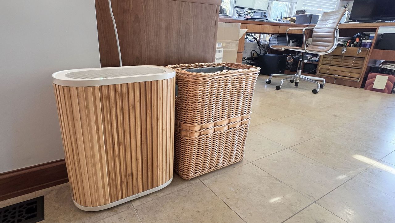 Bamboo Windmill Air Purifier next to rattan trash bin