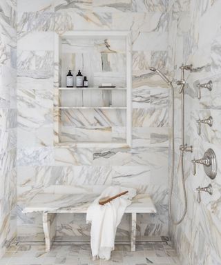 Marble shower with gold accents