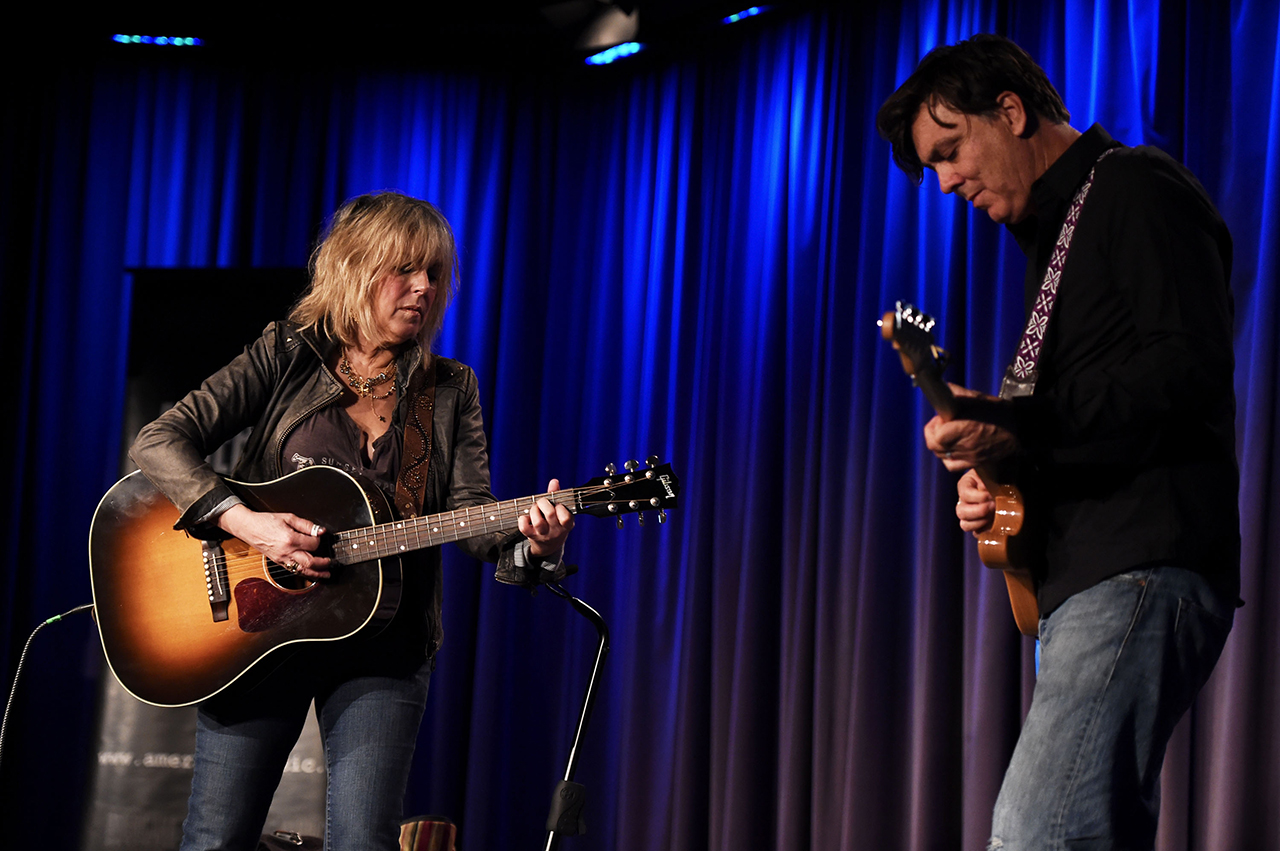 Lucinda Williams (left) and Doug Pettibone perform onstage at The Grammy Museum in Los Angeles, California on October 13, 2014