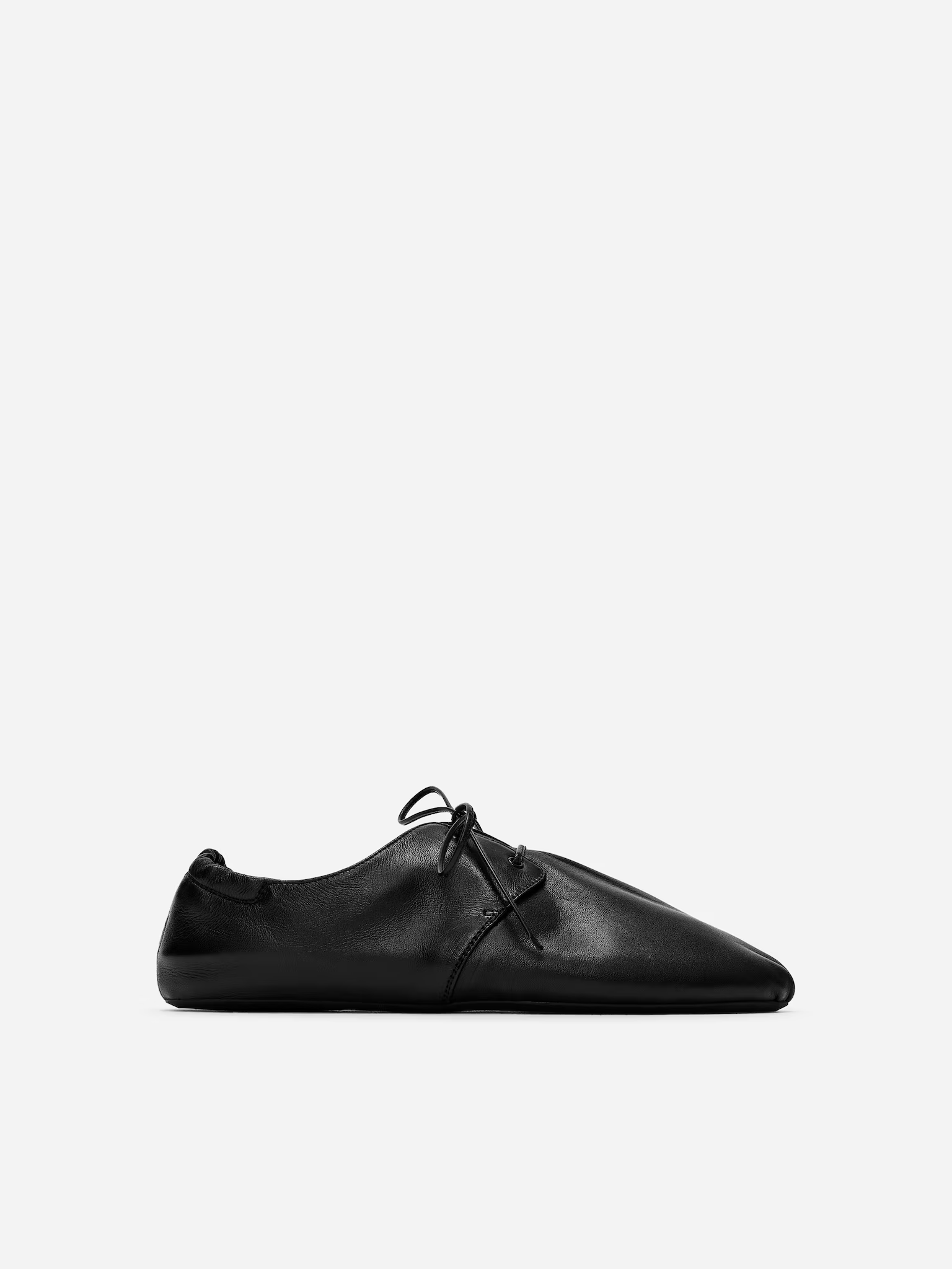 A pair of black Arket jazz shoes.