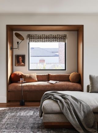 Window nook with rust-colored daybed