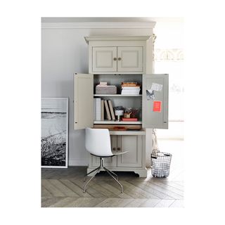 home office with cupboard seating and dustbin