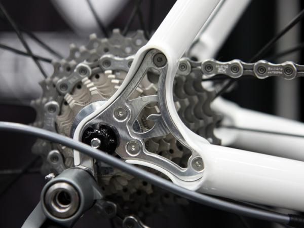 Guru took the typically mundane concept of a replaceable derailleur hanger and turned it into a styling element on its titanium road bike.