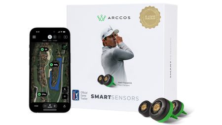 Arccos Golf smart sensors, the box it comes in and a smartphone screen using the Arccos app on a golf course