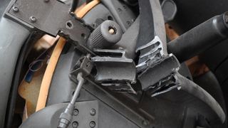 An office chair with a damaged underside