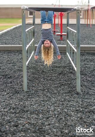 Girl Hanging Upside Down On Monkey Bars by emholk