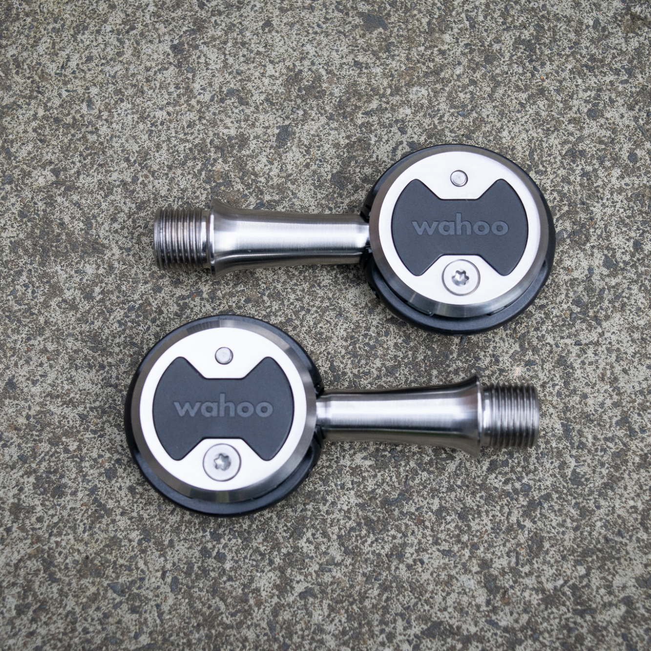 Pair of Wahoo Speedplay Zero clipless pedals on the ground 