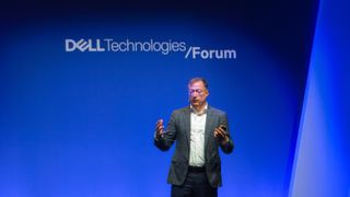 A telephoto shot of John Roese, CTO and chief AI officer at Dell Technologies, onstage at Dell Technologies Forum 2024, in London. Decorative: Roese is pictured from the legs up, against a blue backdrop with the words 'Dell Technologies Forum 2024' in white behind him.