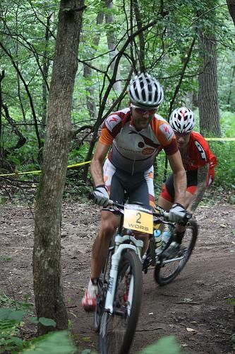 Race leaders Travis Woodruff (#2; Adventure 212 / Specialized) and Mark Lalonde (Planet Bike / GT / T6) charge into a section of singletrack after an open passing section. Lalonde eventually got ahead of Woodruff for the win.