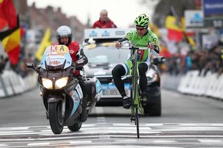Peter Sagan celebrates victory at Gent-Wevelgem with a wheelie as he crosses the finish line